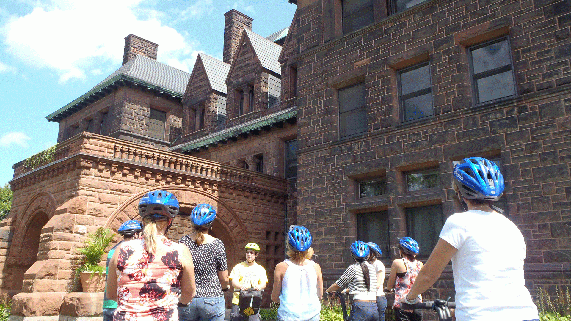 a group of people enjoy sightseeing on a segway tour in Saint Paul, MN